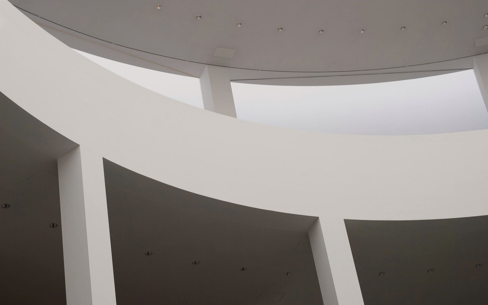 White curved architecture interior of a building.